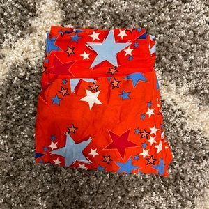 Red background with blue, white, and red stars.